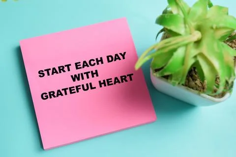 Concept of start each day with grateful heart write on sticky notes Stock Photos