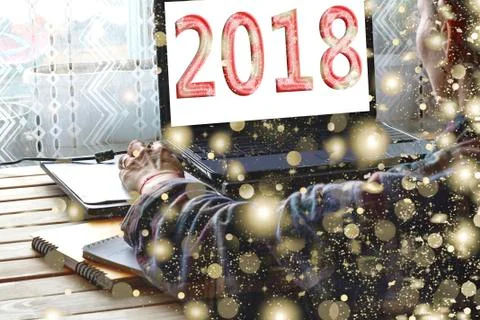 Concept: Start of the New Year. On screen 2018. A freelancer uses a laptop at 스톡 사진