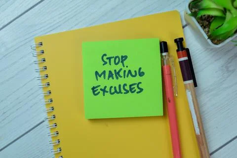 Concept of Stop Making Excuses write on sticky notes isolated on Wooden Table Stock Photos