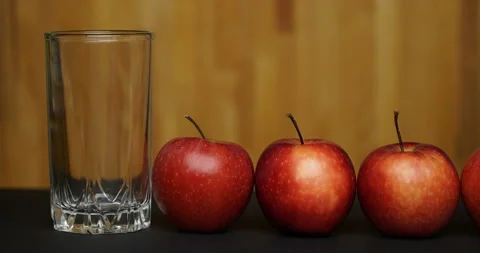 Concept stop motion animation apple and juice. Stock Footage 99318148