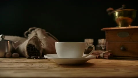 Concept for strong black coffee. Roasted beans poured in cup without processing Stock Footage 138521168
