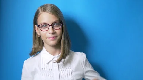 Concept of studying time, back to school. A smart girl schoolgirl with glasses Stock Footage 112713229