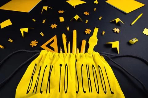 A concept on the subject back to school. The student's yellow stationery on a Photos