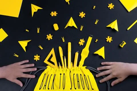 A concept on the subject back to school. The student's yellow stationery on a Stock Photos