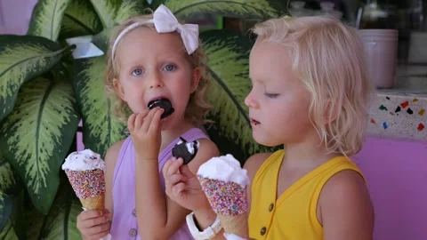 Concept: summer cafe for children with sweets. Parents left their children in a Stock Footage 244691978