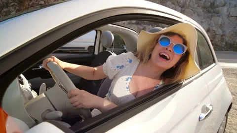 Concept of summer holidays and auto travel. Happy young woman in a hat in a Stock Footage 217684745