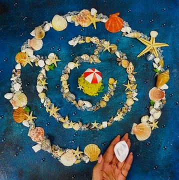 The concept of summer holidays. A maze of shells and starfish. Stock Photos