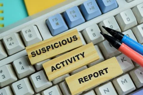 Concept of suspicious activity report text on wooden blocks. Stock Photos