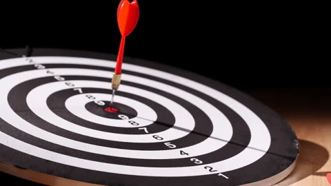 Concept target. Dolly shot red darts arrows in bullseye target or dartboard Stock Footage 293587534