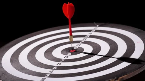 Concept target. Dolly shot red darts arrows in bullseye target or dartboard Stock Footage 293587832