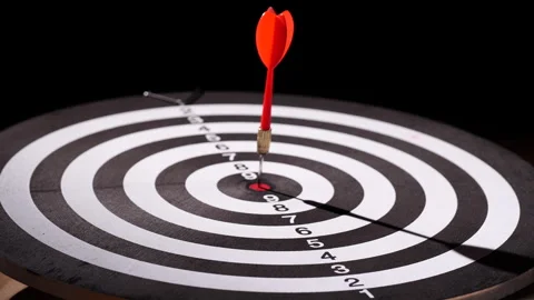 Concept target. Dolly shot red darts arrows in bullseye target or dartboard Stock Footage 293587964