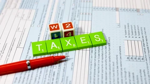 Concept of tax calculations with text blocks on the forms and pen in the st.. Stock Footage 316266900