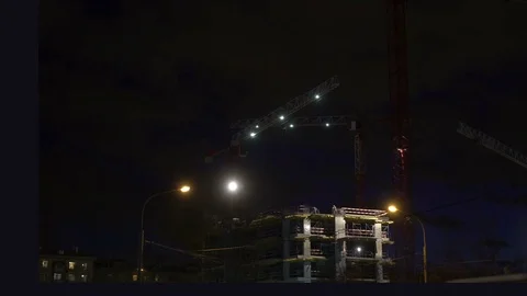 Concept teamwork, crane as symbol new life and changes in night city. Timlapse Video stock 74515440