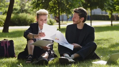 Concept of teamwork on nature background. Two business partners business check Stock Footage 252880801