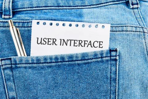 The concept of technology and development. Phrase, word, text USER INTERFAC.. Stockfoto's