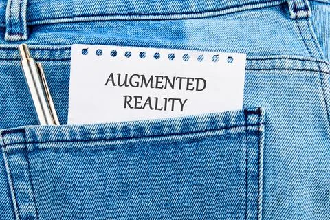 The concept of technology and development. Phrase, words, text AUGMENTED RE.. Stockfoto's