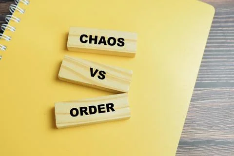 Concept of text chaos versus order on wooden blocks. Stock Photos