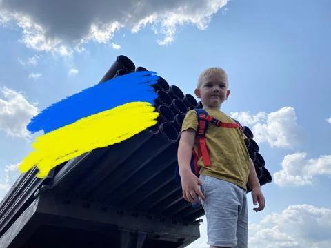 Concept with text child stands in front of a rocket launcher, Ukraine Stock Photos