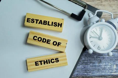 Concept of text establish code of ethics on wooden blocks. Stock-Fotos