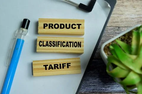 Concept of text product classification tariff on wooden blocks. Photos