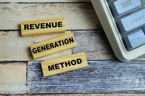 Concept of text revenue generation method on wooden blocks. Stock Photos
