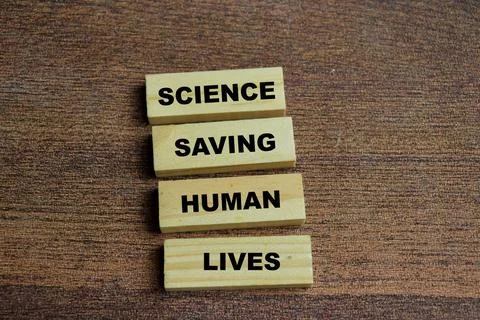 Concept of text science saving human lives on wooden blocks. Stock Photos