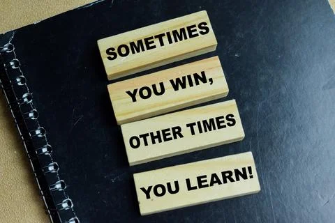 Concept of text sometimes you win, other times you learn on wooden blocks. Stock Photos