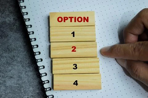 Concept of text time to option 2 symbol on wooden blocks. Stock Photos