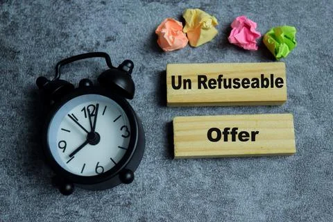 Concept of text un refuseable offer on wooden blocks. Stock Photos
