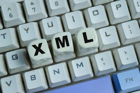 Concept of text XML - Extensible Markup Language on wooden blocks. Photos