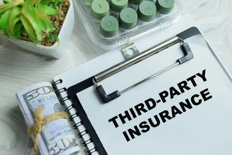 Concept of third=party insurance write on clipboard isolated on Wooden Table Stock Photos