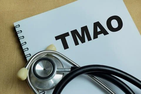 Concept of TMAO write on book isolated on Wooden Table Stock Photos