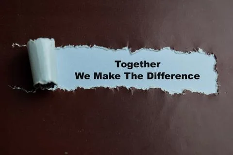 Concept of Together We Make The Difference Text written in torn paper. Stock Photos