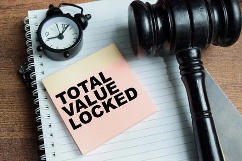 Concept of total value locked write on sticky notes isolated on Wooden Table. Stock Photos