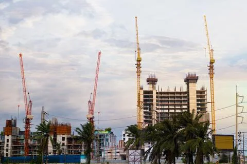 The concept of a tower crane in construction is to build a big city. Stock Photos