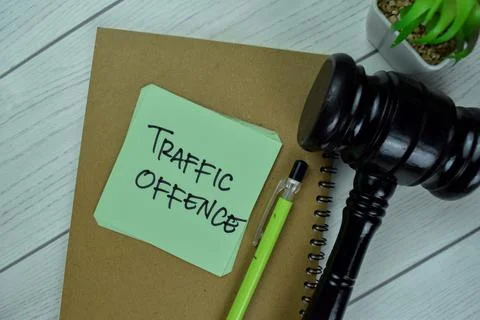 Concept of Traffic Offence write on sticky notes with gavel Stock Photos