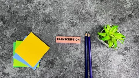 Concept of Transcription write on sticky notes isolated on Wooden Table. 스톡 사진