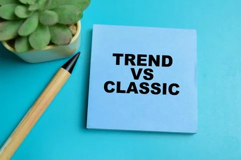 Concept of trend vs classic write on sticky notes isolated on table. Stock Photos