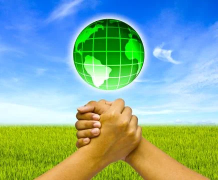 Concept two coupled hands with globe. Stock Photos