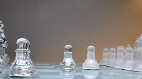Concept two pawns standing opposite, two powers, glass chess Stock Footage 126960525
