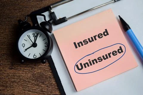Concept of uninsured blue circle write on sticky notes Stock Photos