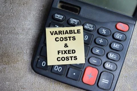 Concept of Variable costs and fixed costs write on sticky notes 스톡 사진