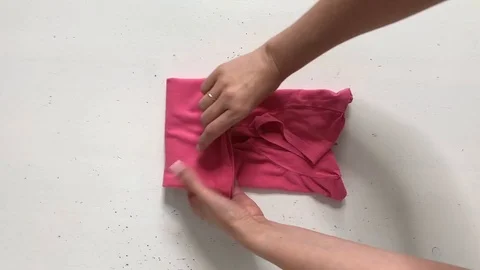 Concept of vertical storage, clearing, order, organization of space. Woman folds Stock Footage 113352727