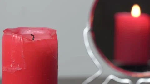 Concept video of a lighted candle that is not reflected in the mirror 動画素材 144422296