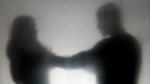 Concept of violence. Aggressive man argues and grabs woman by the neck.  Stock Footage 295453178