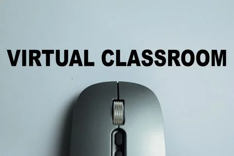 Concept of virtual classroom write on book with isolated on Wooden Table. Stock Photos