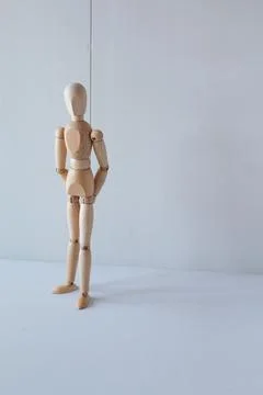 Concept of waiting to stand or rest on the street with a wooden doll as a model Stock Photos