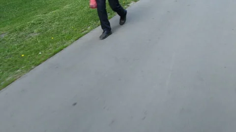 The concept of walking in park. Close-up shot of an unrecognizable people Stock Footage 243706855