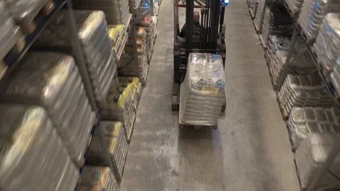 Concept of warehouse. The forklift in the big warehouse on manufacturing plant Stock Footage 121010807