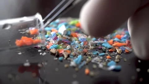 Concept of water pollution and global warming. Macro shot of microplastics. Stock Footage 241065800